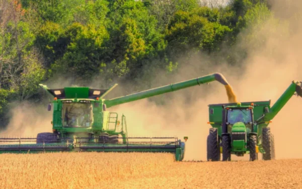 green tractor in crop field