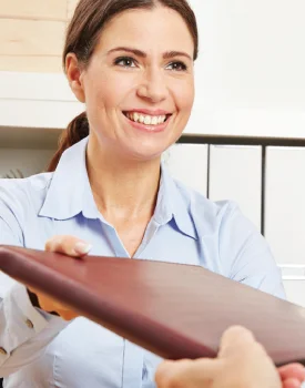 accounting woman handing a file to another person