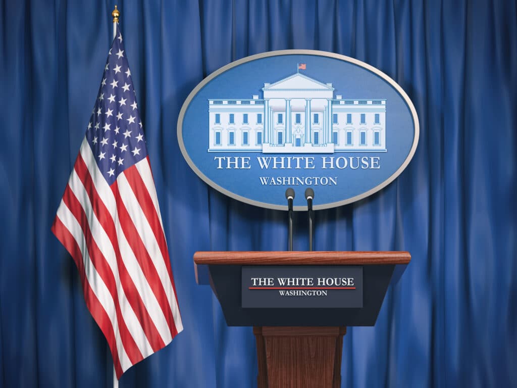 Politics of White House and President of USA United states concept.  Podium speaker tribune with USA flags and sign of White House. 3d illustration