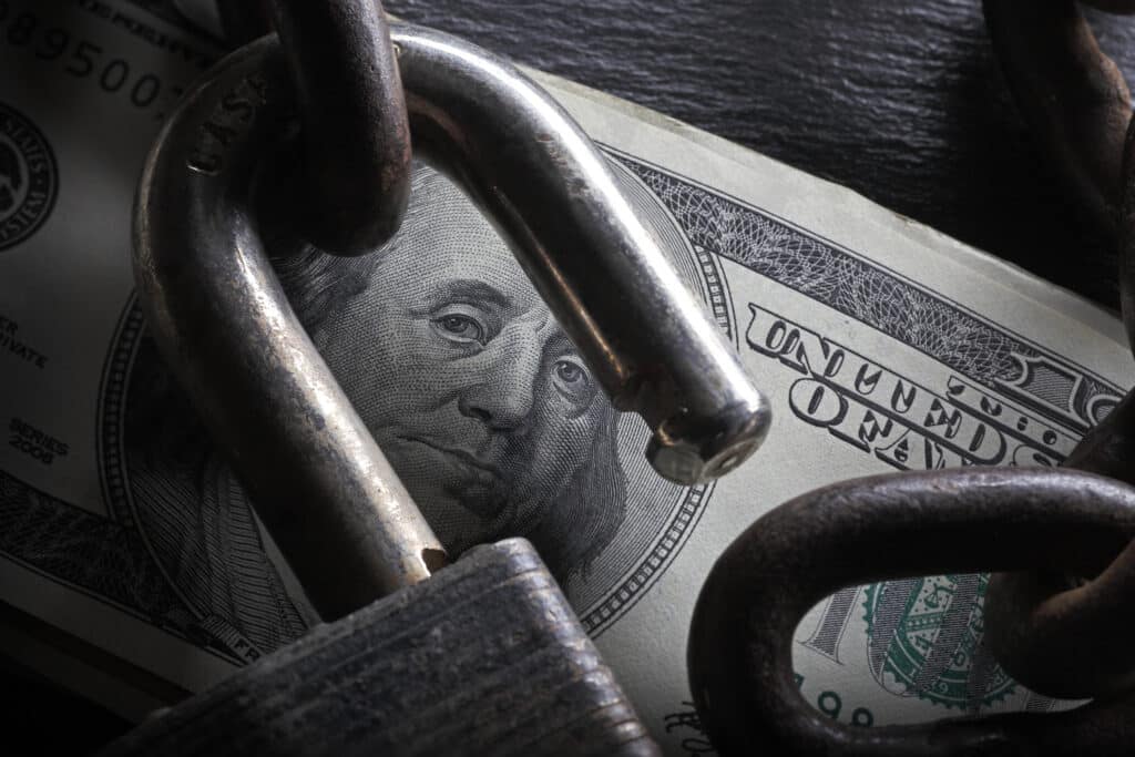 An open lock on a stack of $100 bills.To see more of my financial images click on the link below: