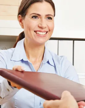 accounting woman handing a file to another person