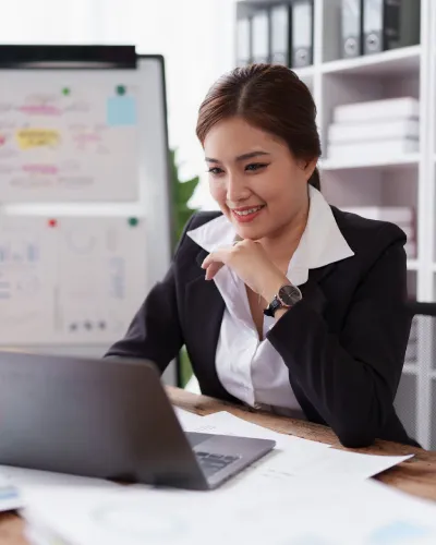 woman accountant working at a table on her computer
