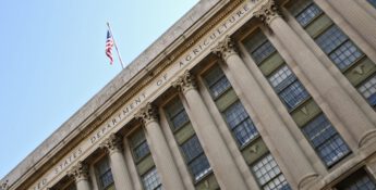 Facade of the United States Department of Agriculture building, featuring large columns and an American flag at the top, symbolizing its commitment to initiatives like ERP and PARP.