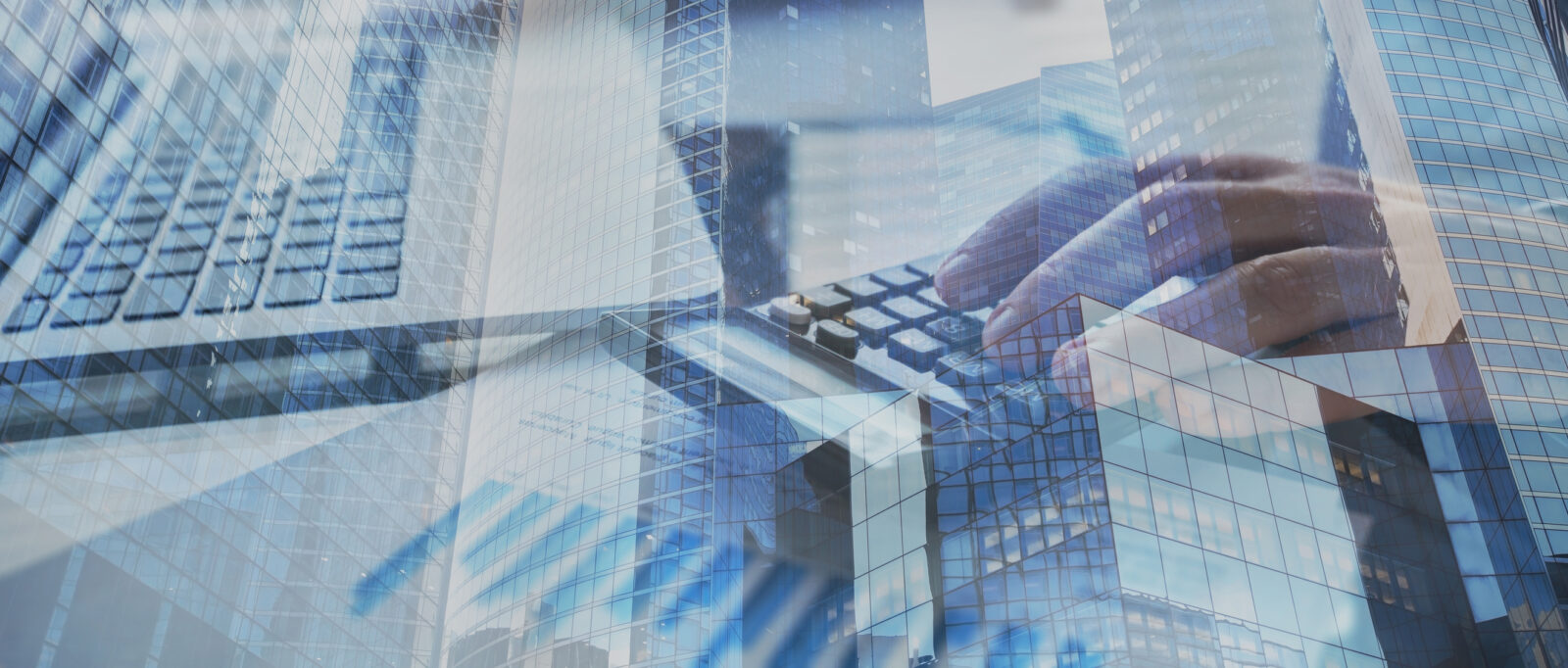 A transparent view of a person's hands calculating with skyscraper reflections, subtly echoing the principles of the Equal Credit Opportunity Act.