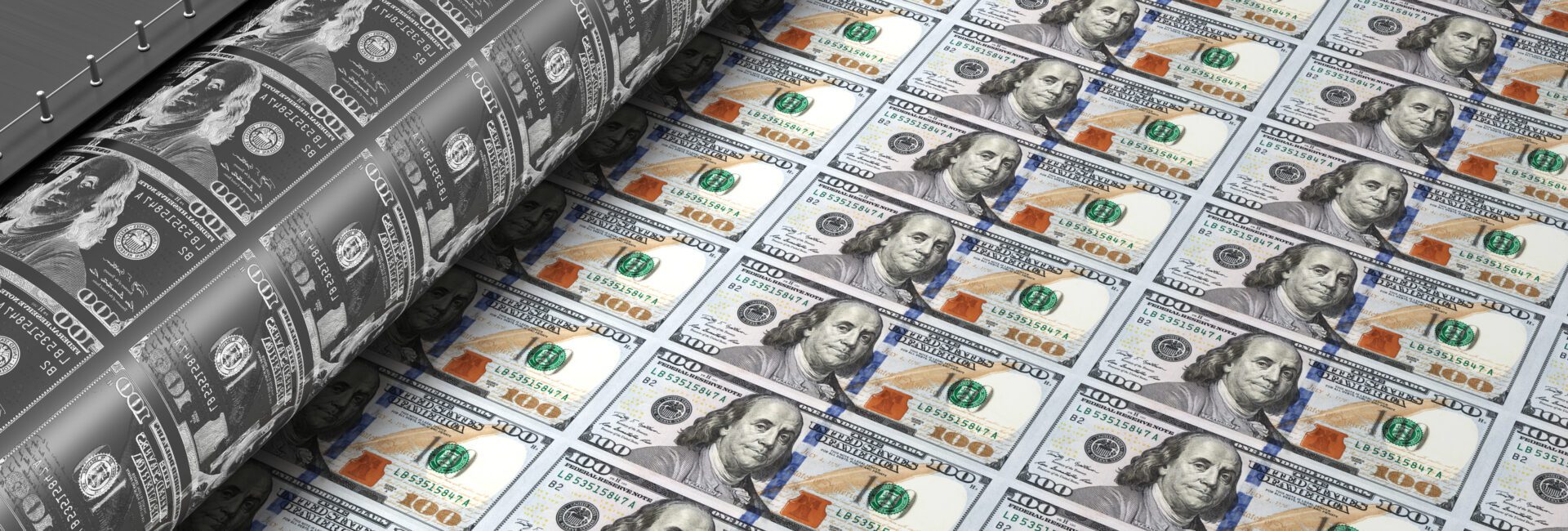 Printing press producing sheets of U.S. hundred-dollar bills.