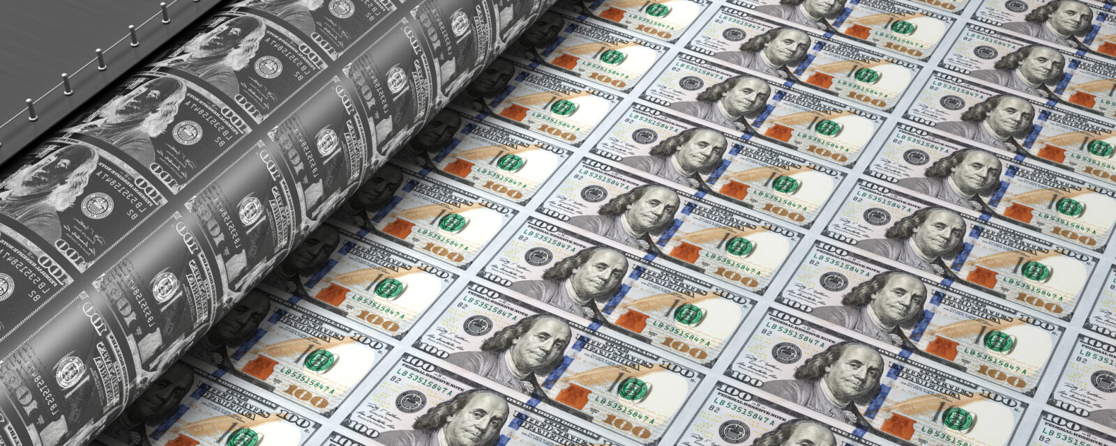 Printing press producing sheets of U.S. hundred-dollar bills.