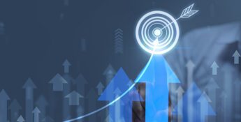 A person touches a virtual target icon, surrounded by upward arrows and a rising graph, symbolizing growth, success, and effective cash flow management on a digital interface.