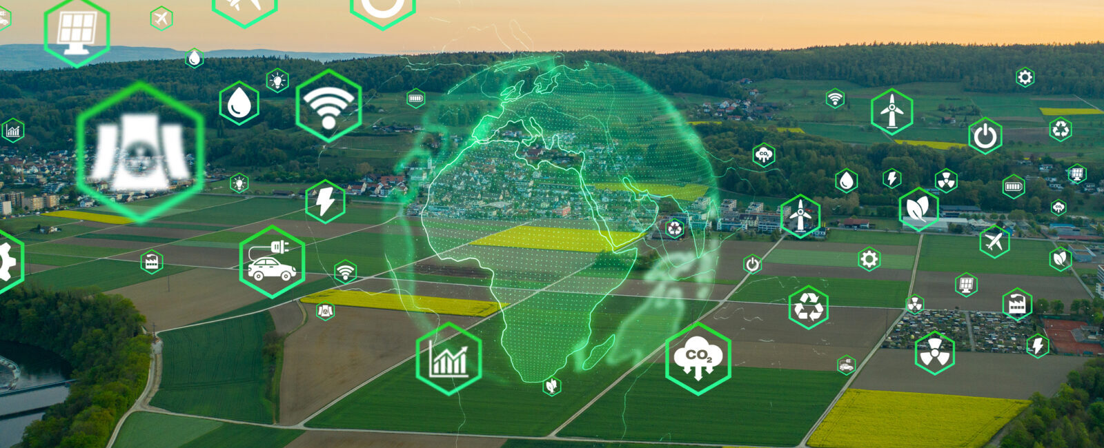 Aerial view of farmland with digital icons representing technology and sustainability, and a green globe overlay in the center.