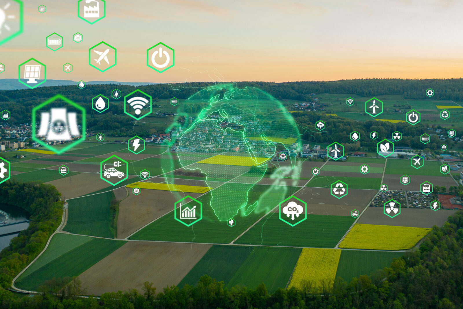 Aerial view of farmland with digital icons representing technology and sustainability, and a green globe overlay in the center.