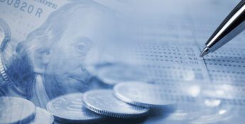 Close-up of a pen, coins, and a dollar bill overlaid with a blurred financial statement, symbolizing money management or financial planning.