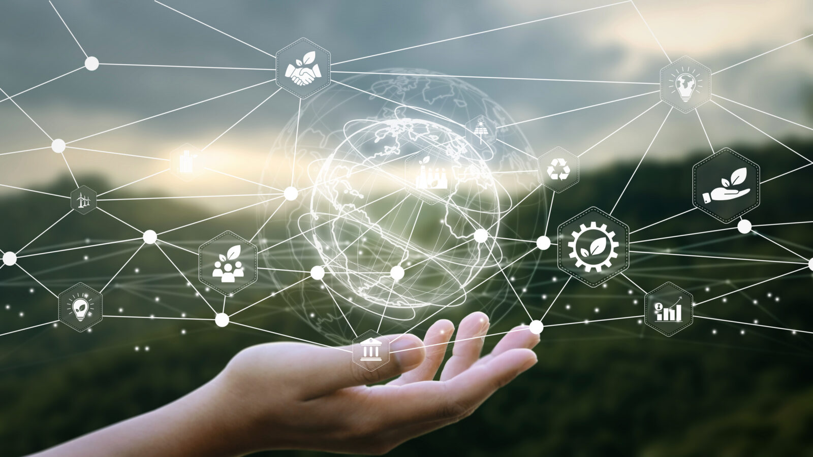 A hand is held up with digital icons and network lines floating above it, representing global connectivity, technology concepts, and the importance of Sustainability Data Management.