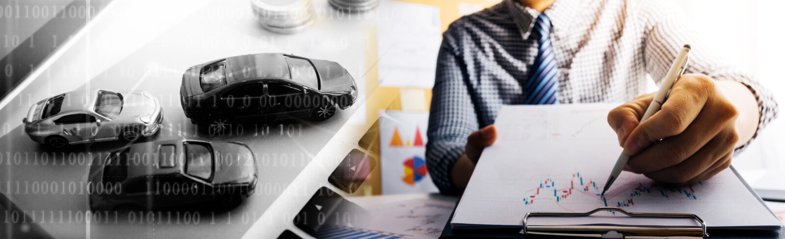 Two toy cars on a surface with binary code overlay, next to a person in business attire writing on a clipboard—highlighting how recent IRS Guidance simplifies auto loan interest reporting under OBBBA, as illustrated by the graphs in the background.