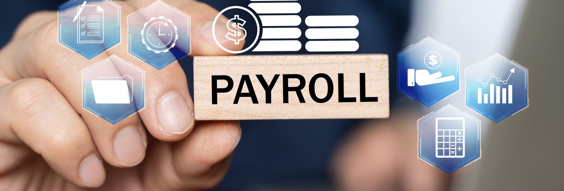 A person holds a wooden block labeled "PAYROLL" surrounded by digital icons representing financial and business concepts.