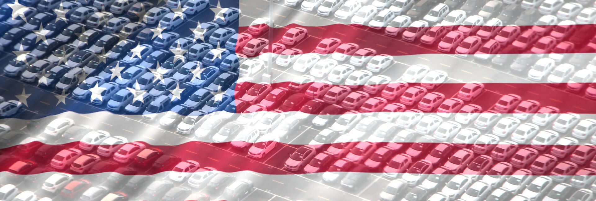Rows of cars in a parking lot overlaid with a transparent image of the United States flag, symbolizing Charitable Donations With Key Tax Strategies.