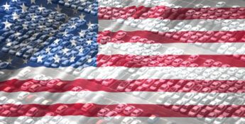Rows of cars in a parking lot overlaid with a transparent image of the United States flag, symbolizing Charitable Donations With Key Tax Strategies.