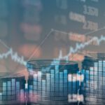 Stacks of coins arranged in ascending order with a transparent overlay of financial graphs and numbers in the background.