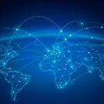 Digital illustration of a world map with glowing lines and nodes, symbolizing Pinion Global Network’s expanding global footprint with IFAC Ireland and representing international communication and connectivity.