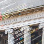 Columns of the US Treasury Department building with overlaid computer code, symbolizing the intersection of finance and technology.