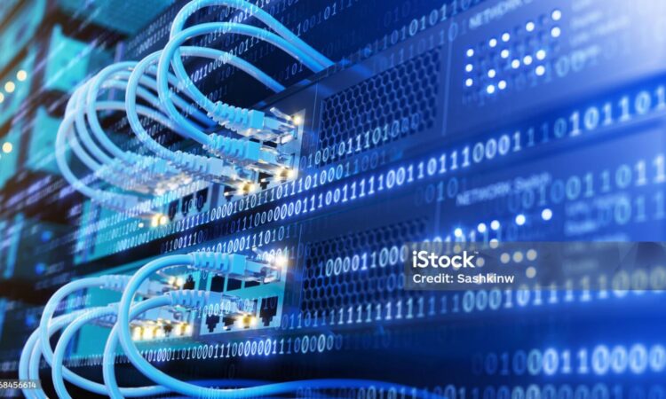 Close-up of network cables connected to servers in a data center, with binary code overlay representing digital data transfer and communication.